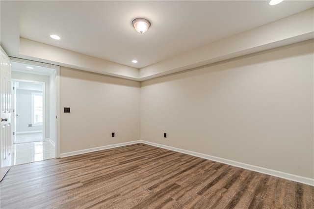 empty room with wood-type flooring