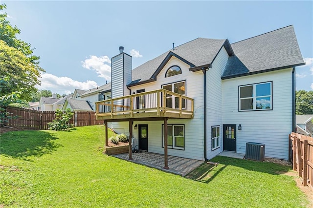 back of house with cooling unit, a yard, a patio, and a wooden deck