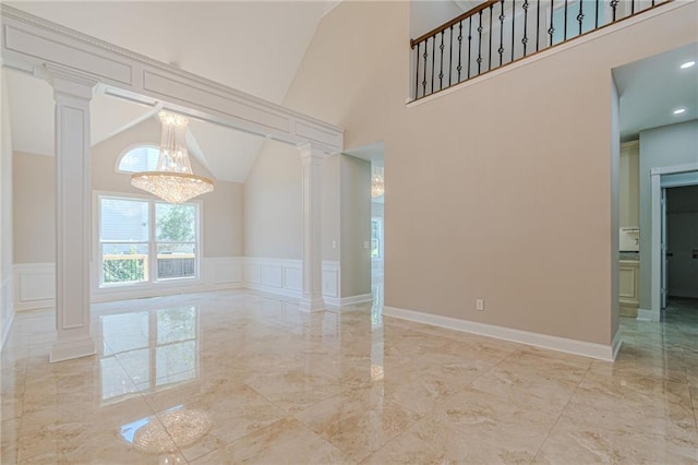 empty room with ornate columns and high vaulted ceiling