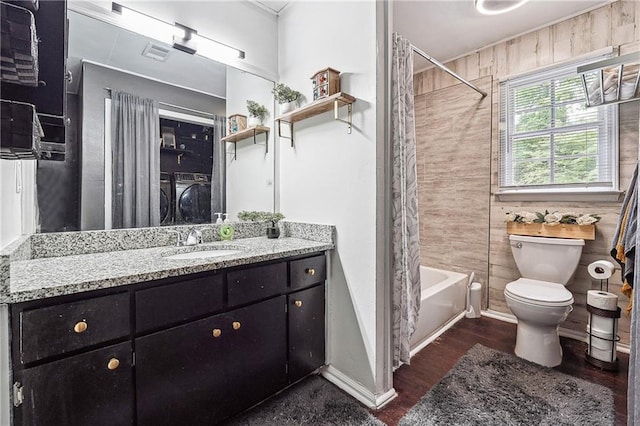 full bath featuring vanity, shower / tub combo with curtain, visible vents, wood finished floors, and toilet