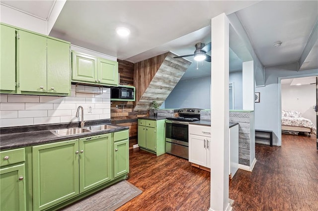 kitchen with a sink, dark wood-style floors, black microwave, and stainless steel electric range oven
