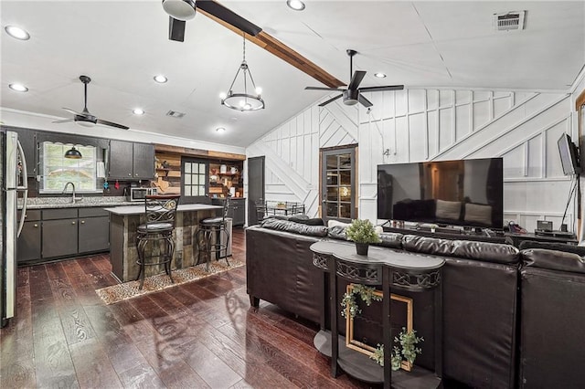 living room featuring visible vents, dark wood-type flooring, recessed lighting, a ceiling fan, and vaulted ceiling