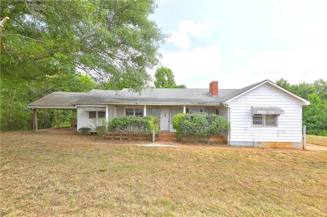 6191 Cumming Hwy, Canton, GA 30115 - ranch-style house featuring a front lawn, a chimney, and an attached carport