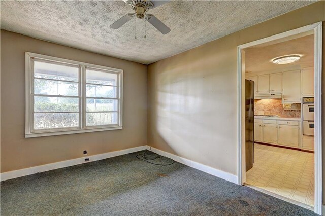 6191 Cumming Hwy, Canton, GA 30115 - empty room with a textured ceiling, light carpet, baseboards, and ceiling fan