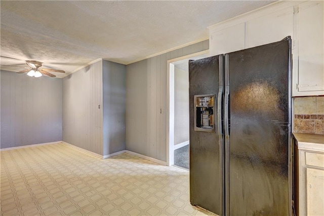 6191 Cumming Hwy, Canton, GA 30115 - empty room with ceiling fan, baseboards, light floors, ornamental molding, and wooden walls