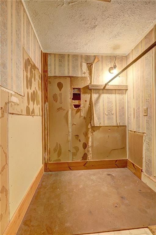 6191 Cumming Hwy, Canton, GA 30115 - basement with a textured ceiling and baseboards