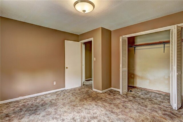 6191 Cumming Hwy, Canton, GA 30115 - unfurnished bedroom with carpet floors, a closet, and baseboards