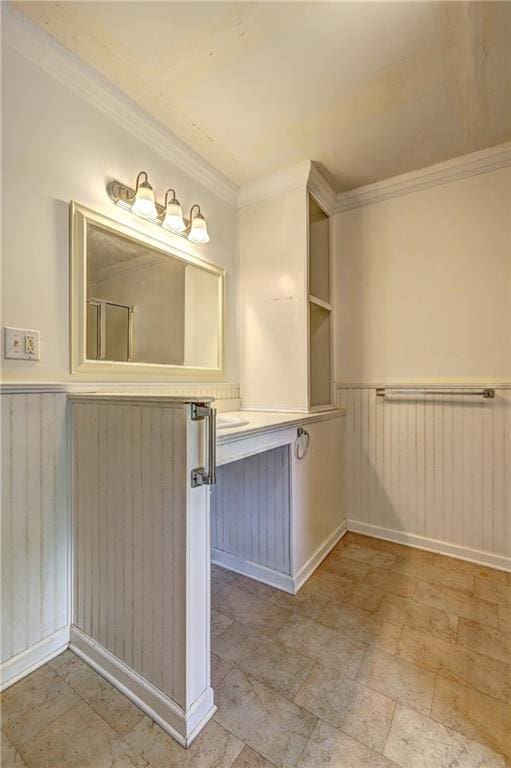 6191 Cumming Hwy, Canton, GA 30115 - bathroom with vanity, wainscoting, ornamental molding, and stone finish flooring