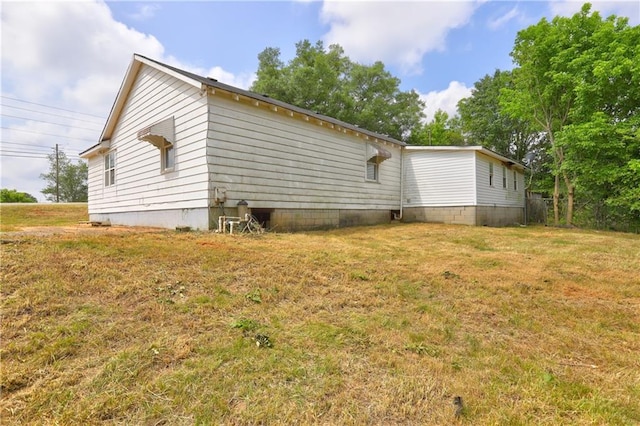 6191 Cumming Hwy, Canton, GA 30115 - view of home's exterior with a lawn