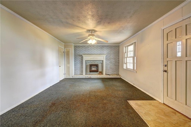 6191 Cumming Hwy, Canton, GA 30115 - unfurnished living room featuring ceiling fan, crown molding, a textured ceiling, a brick fireplace, and dark carpet