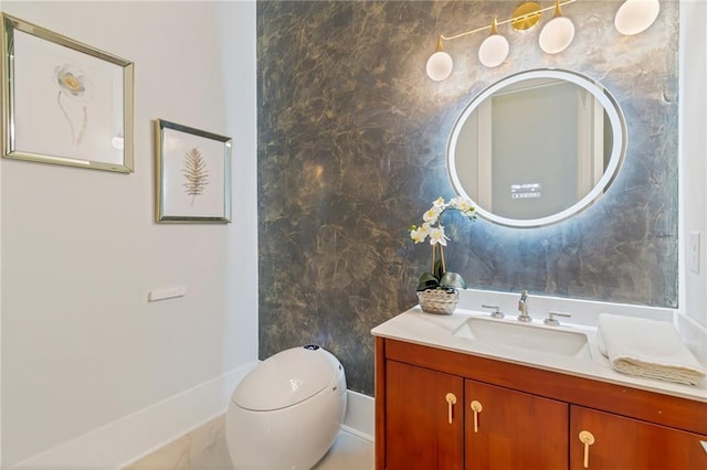 bathroom with toilet and vanity