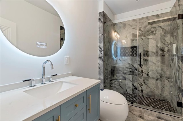 full bathroom with a marble finish shower, toilet, and vanity