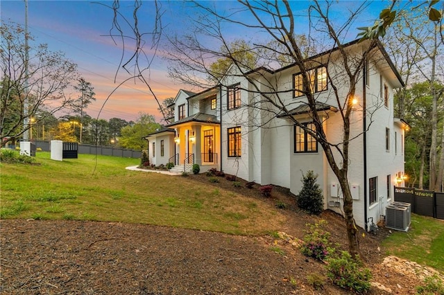 view of front of property with a front yard and fence