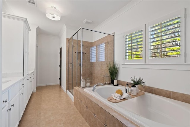 7165 Cordery Rd, Cumming, GA 30040 - bathroom with a bath, vanity, a shower stall, and tile patterned floors