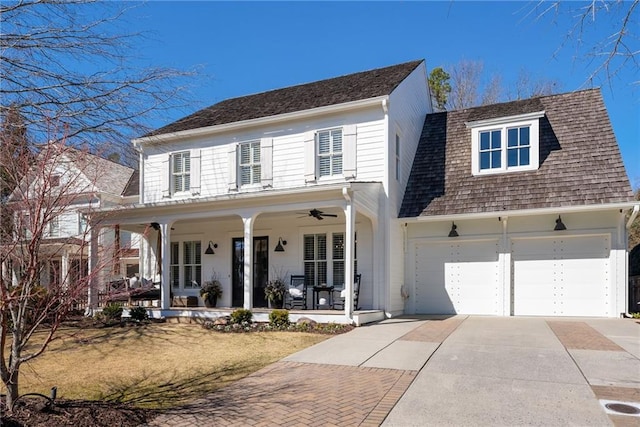 7165 Cordery Rd, Cumming, GA 30040 - view of front facade featuring concrete driveway, covered porch, an attached garage, and a shingled roof