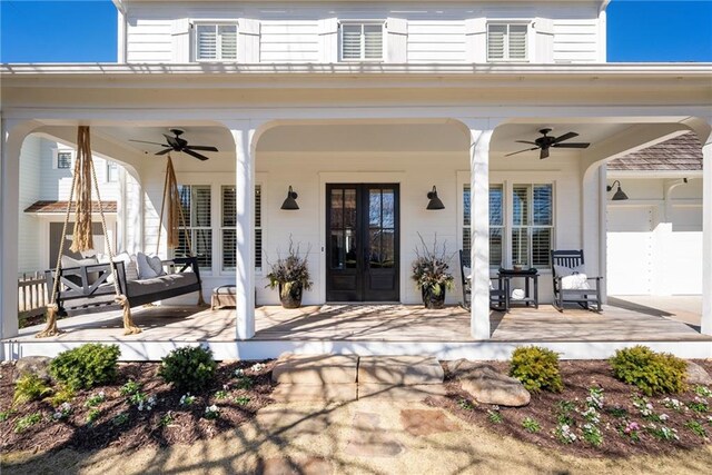 7165 Cordery Rd, Cumming, GA 30040 - entrance to property featuring a ceiling fan, french doors, and a porch