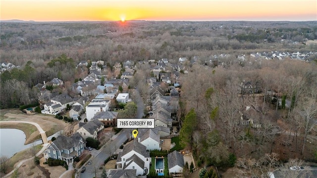 7165 Cordery Rd, Cumming, GA 30040 - aerial view at dusk of a residential view and a forest view