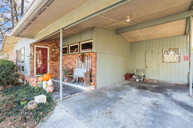 view of exterior entry featuring a carport