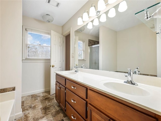 bathroom with vanity and independent shower and bath