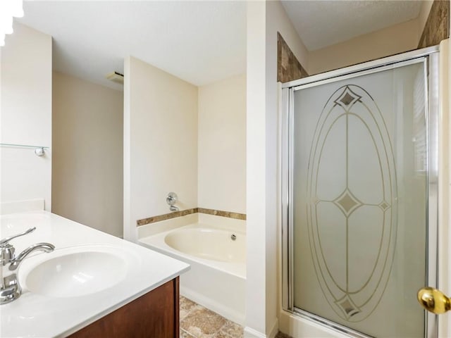 bathroom featuring vanity and separate shower and tub