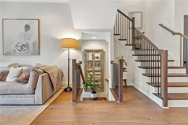 stairs featuring hardwood / wood-style flooring