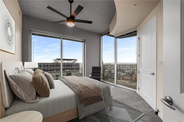 bedroom featuring ceiling fan, access to outside, multiple windows, and carpet