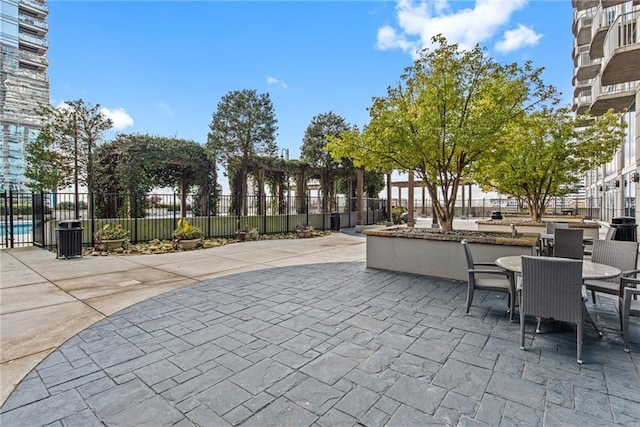 view of patio / terrace with outdoor dining area and fence