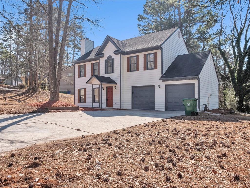 colonial-style house featuring a garage