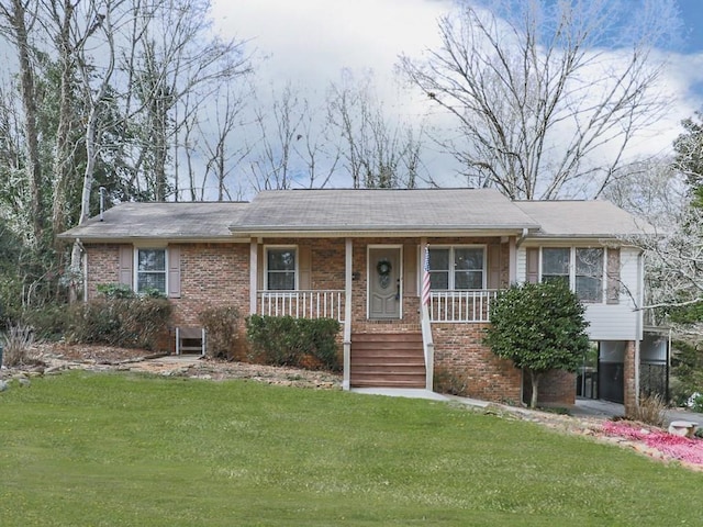 view of front of house with a front yard and a porch