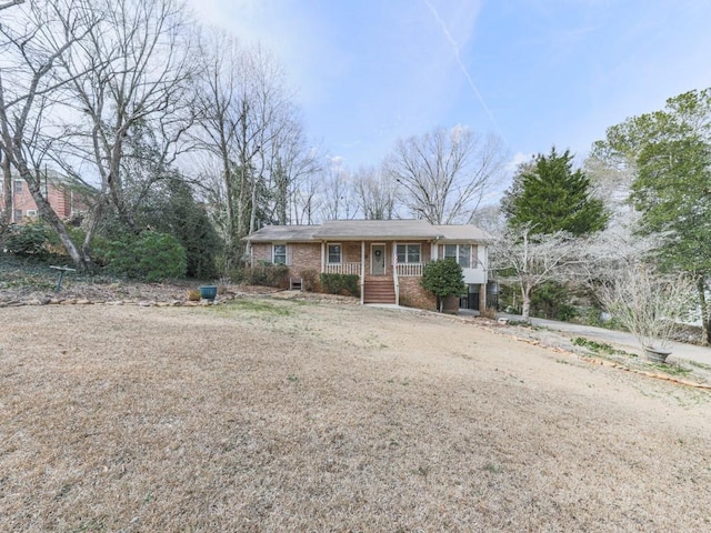 ranch-style home featuring covered porch