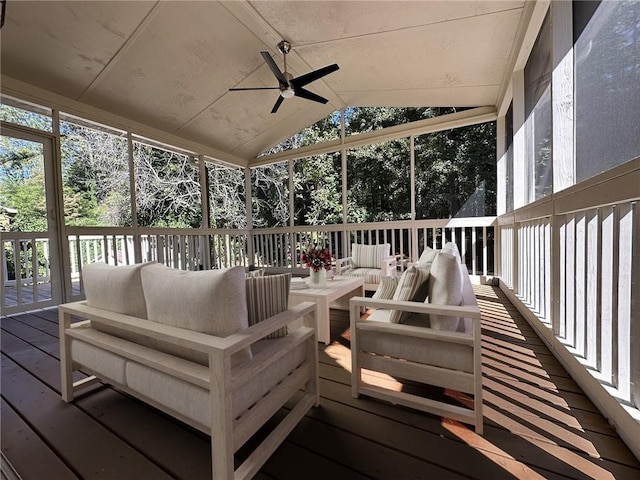 sunroom / solarium with a ceiling fan and lofted ceiling