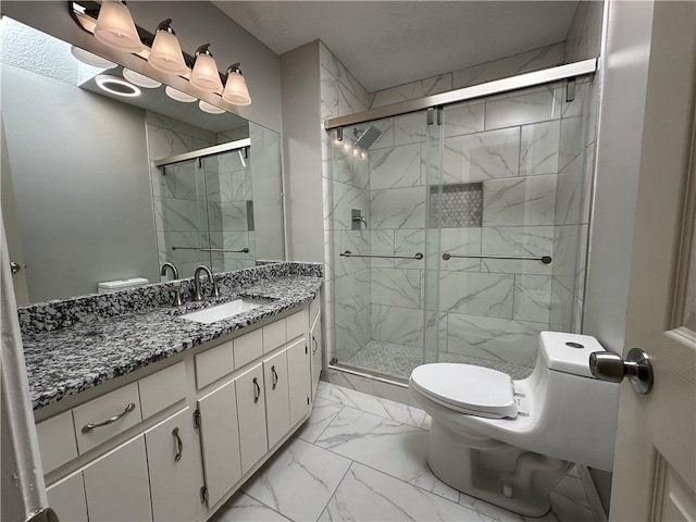 bathroom with marble finish floor, a shower stall, toilet, and vanity