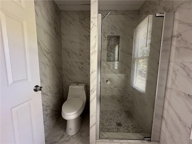 bathroom featuring marble finish floor, a marble finish shower, and toilet