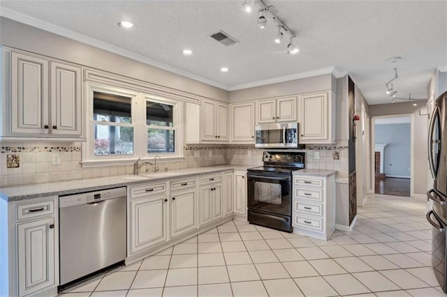 kitchen featuring tasteful backsplash, sink, crown molding, light tile patterned flooring, and stainless steel appliances