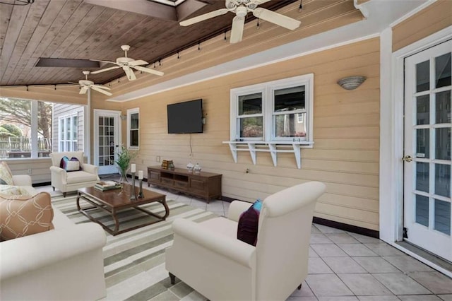 exterior space with lofted ceiling, wood ceiling, light tile patterned flooring, and wooden walls