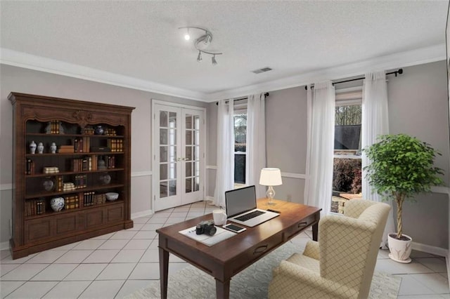 office space featuring french doors, plenty of natural light, a textured ceiling, and ornamental molding