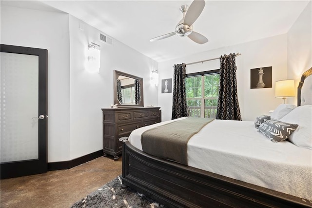 bedroom featuring baseboards, ceiling fan, and concrete flooring