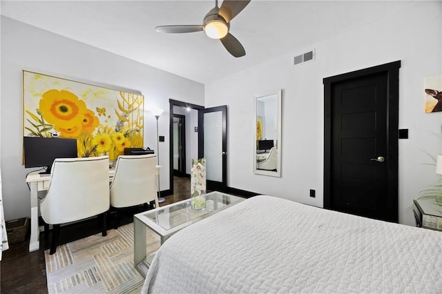 bedroom with concrete floors, vaulted ceiling, ceiling fan, and baseboards