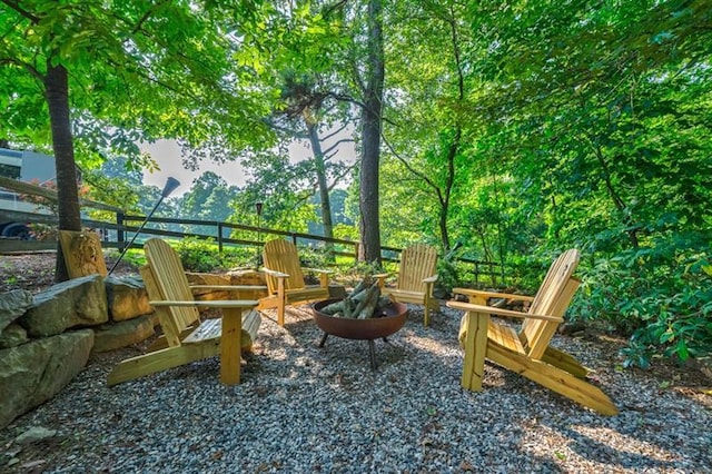 view of patio with a fire pit