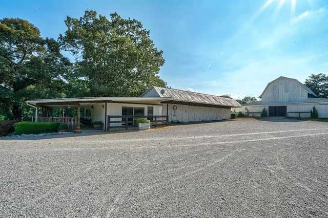 view of front of home featuring an outbuilding