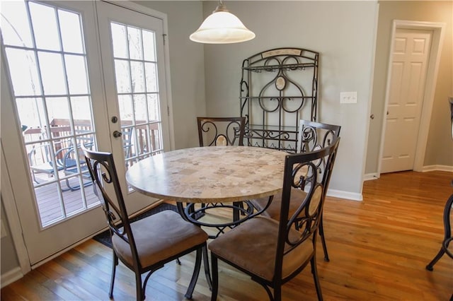 dining area featuring hardwood / wood-style floors and french doors