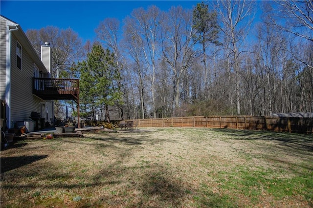 view of yard featuring a wooden deck