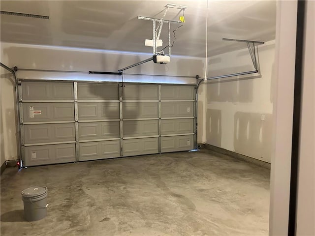 garage featuring a garage door opener