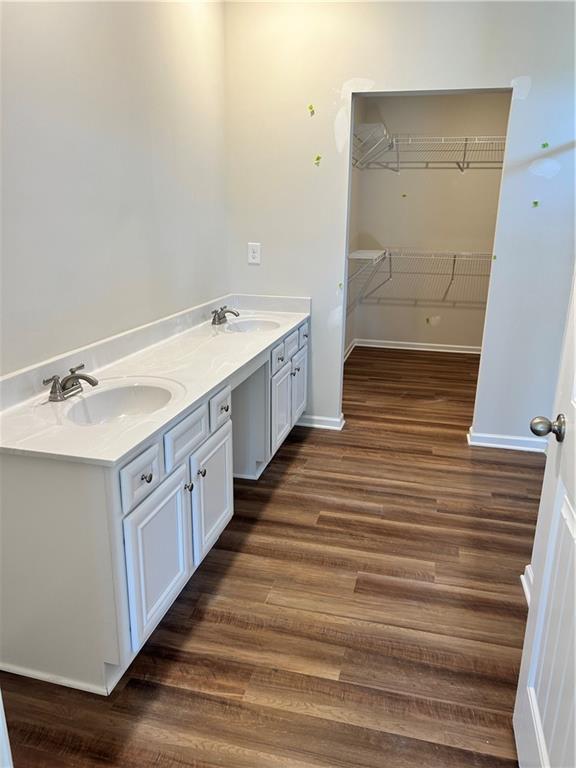 bathroom featuring vanity and hardwood / wood-style flooring