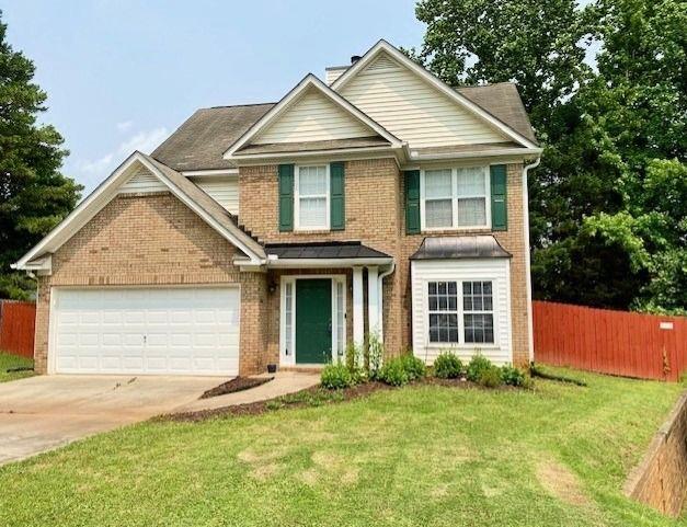 4424 High Gate Dr NW, Acworth, GA 30101 - traditional-style home with brick siding, an attached garage, driveway, and a chimney