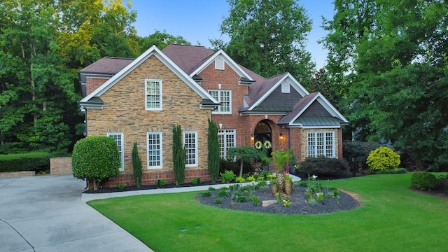 craftsman-style home with a front lawn