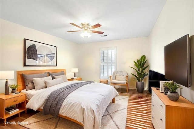 bedroom featuring ceiling fan and wood-type flooring