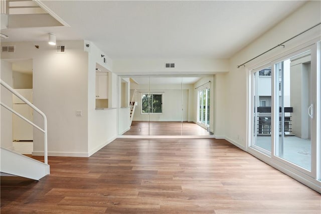 587 Virginia Ave NE Unit 315, Atlanta, GA 30306 - interior space with stairway, visible vents, and wood finished floors