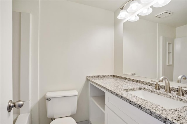 587 Virginia Ave NE Unit 315, Atlanta, GA 30306 - bathroom featuring visible vents, toilet, and vanity
