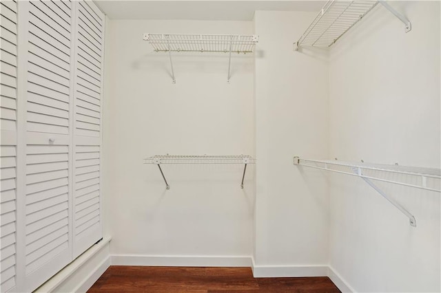 587 Virginia Ave NE Unit 315, Atlanta, GA 30306 - walk in closet with dark wood finished floors